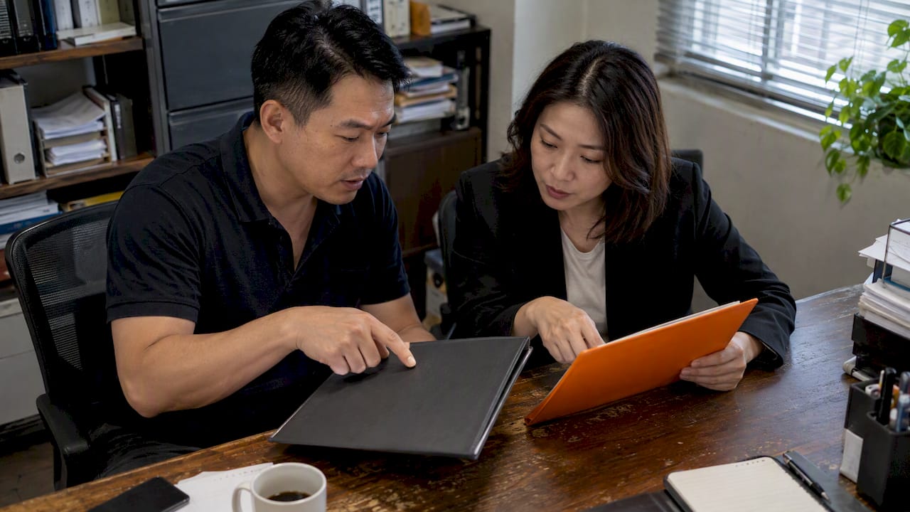 SME owner comparing two contract options